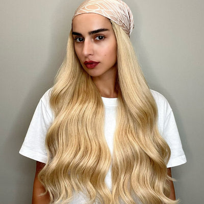 A radiant golden blonde, infused with a blend of light blonde highlights for an authentically natural appearance. This shade epitomizes the essence of a true yellow blonde, capturing the luminous, carefree glow of sunlit strands.