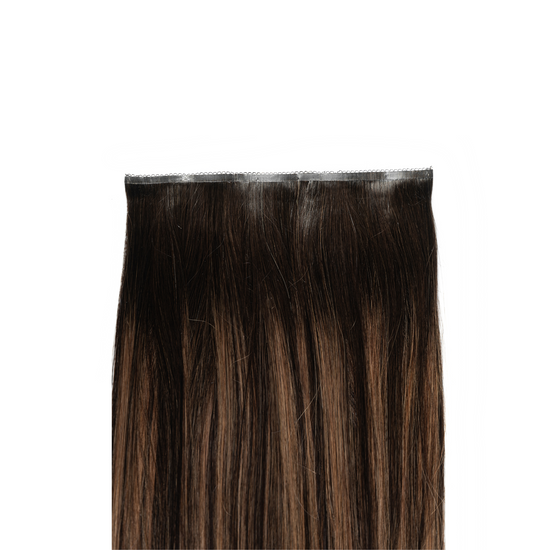 This boasts a dark brown base, contrasted strikingly with thicker ash blonde highlights. This bold interplay of deep and cool tones creates a sophisticated, edgy look. 