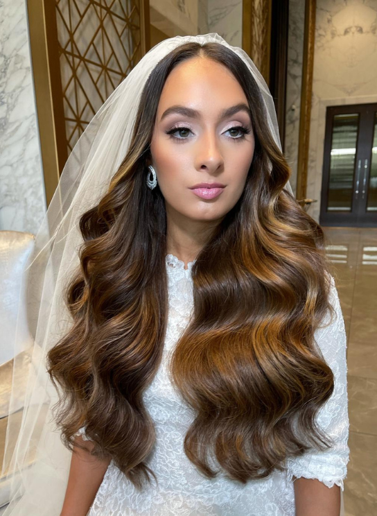The bride after applying clip-in hair extensions