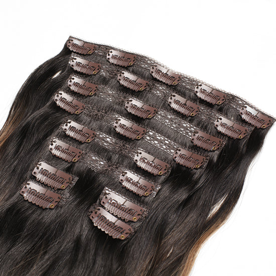 Back of 8 piece weft clip in hair extensions in the color Brown Ash Highlight