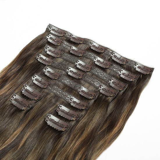 Back weft of a 10 piece clip in hair extensions in the color Caramel Balayage